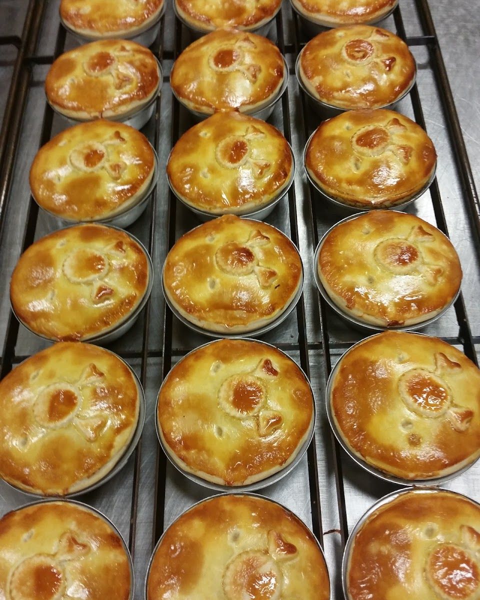 A tray of freshly baked pies